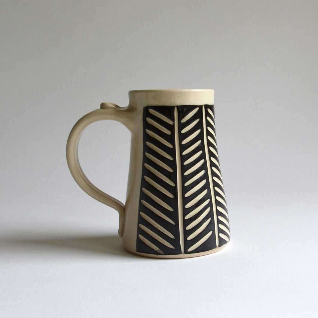 Large black and white mug in herringbone pattern